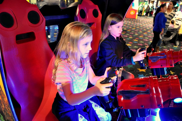 Zoë and Kaylee playing video games at John's Incredible Pizza in Buena Park, CA