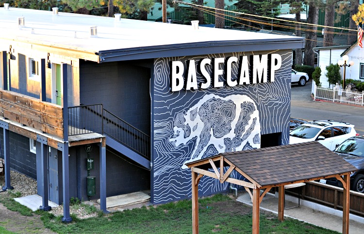 Basecamp sign with painted bear art on hotel