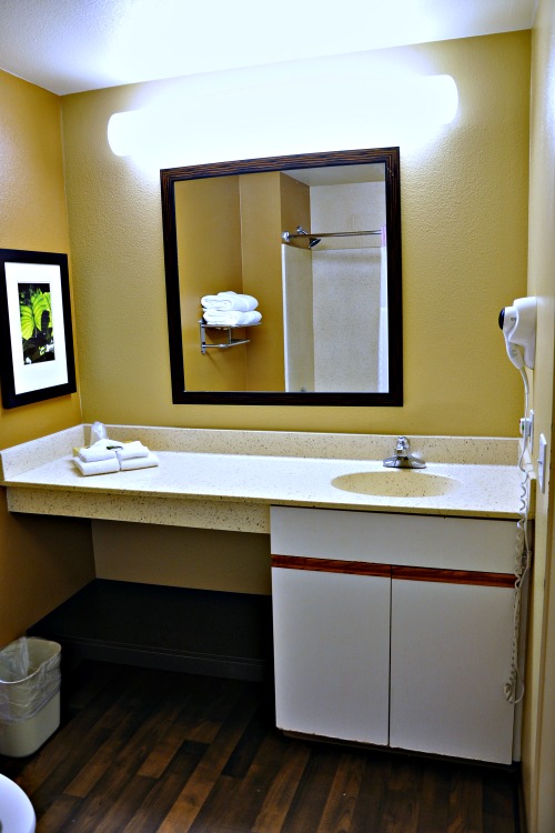 Sink and mirror in Extended Stay America hotel room