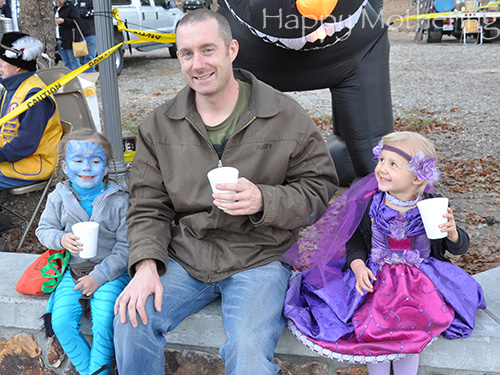 Brian, Zoe and Kaylee drinking hot chocolate on Halloween