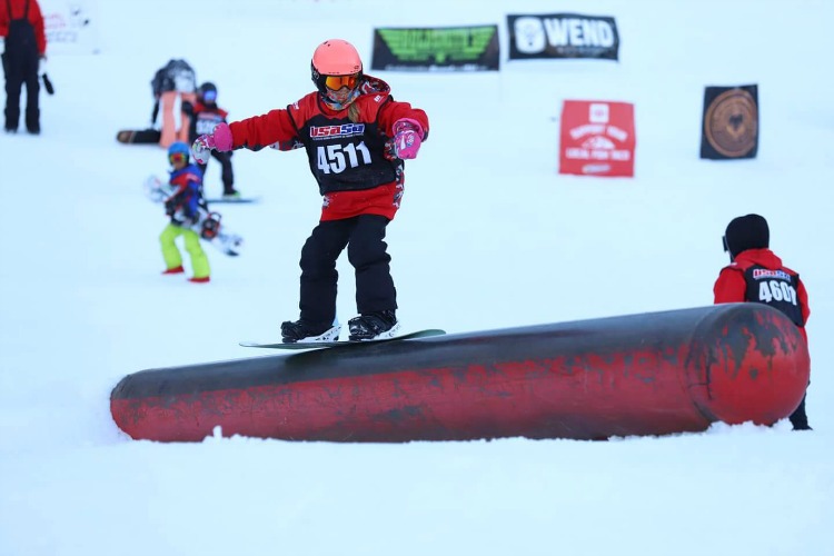 Zoë riding the tube at Rail Jam