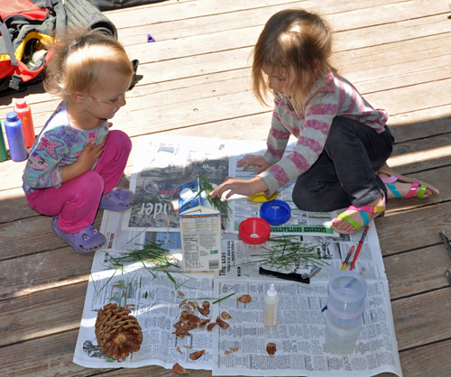 Zoë and Kaylee decorating their bird house