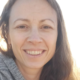Chrystal smiling by lake with sun out