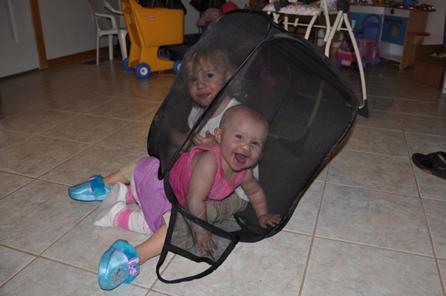 Zoë and Kaylee playing in pop up hamper