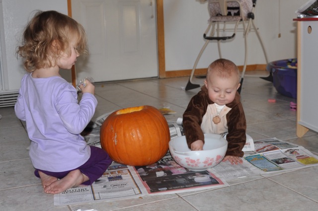 Zoë and Kaylee Seeding the Pumpkin