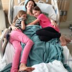 Chrystal, Zoe and Kaylee in a hospital bed in San Diego