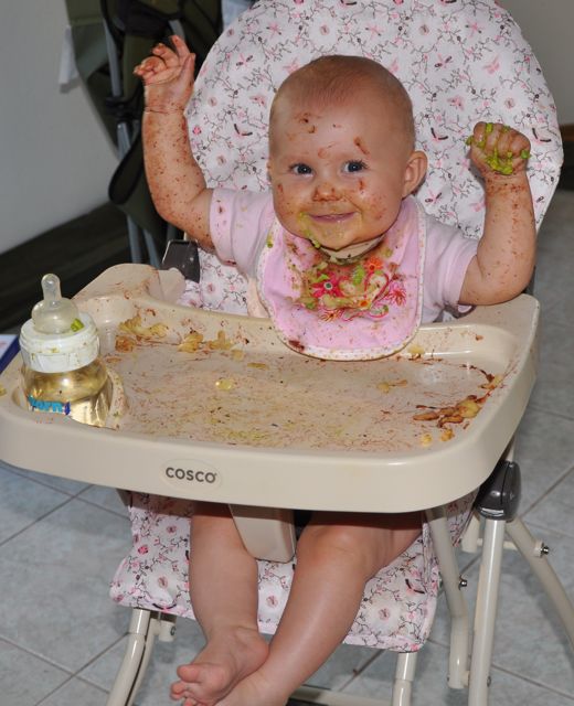 Kaylee covered in food after feeding herself