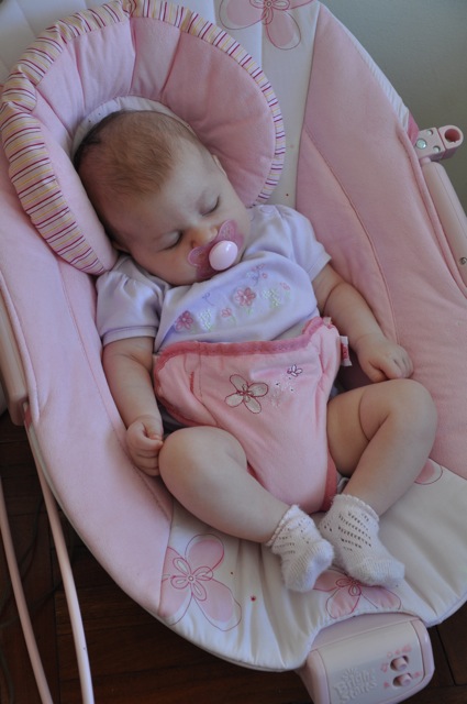 Kaylee sleeping in her pink bouncy seat