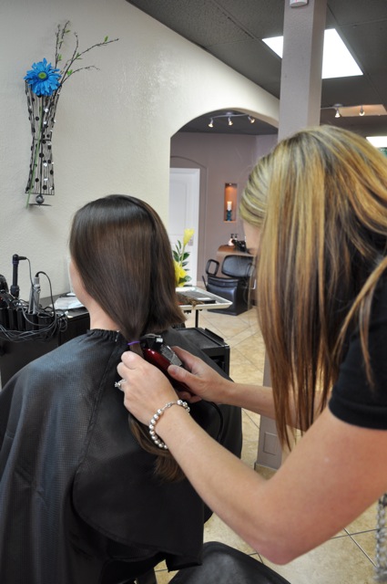 Sarah cutting my hair with clippers