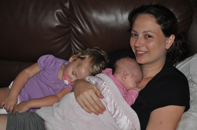 Zoë and Kaylee napping on Chrystal on the couch