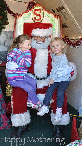 Zoë and Kaylee asking Santa for snowboards