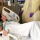 Chrystal laying in a hospital bed in September 2018