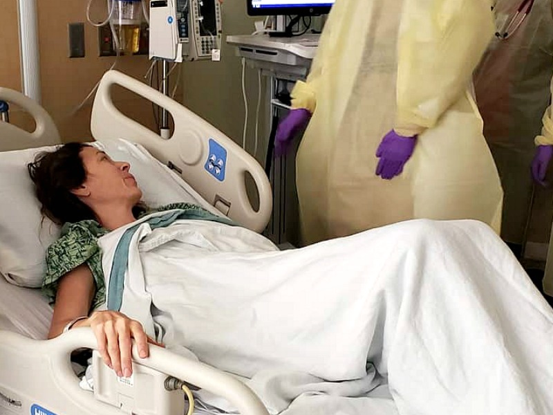 Chrystal laying in a hospital bed in September 2018