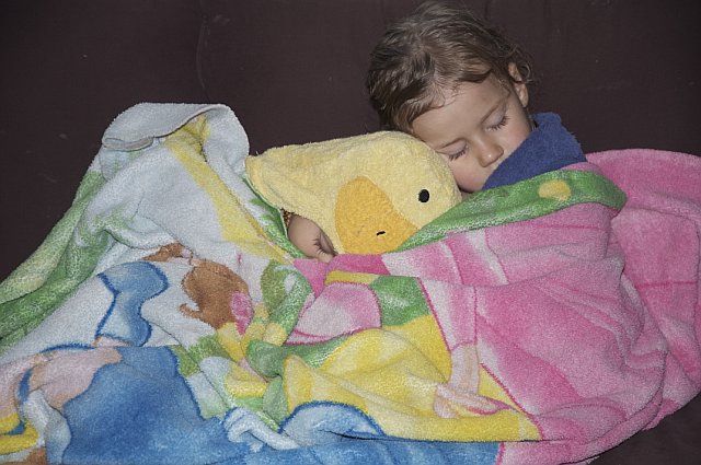 Zoë and Kaylee sleeping on the couch after a nap