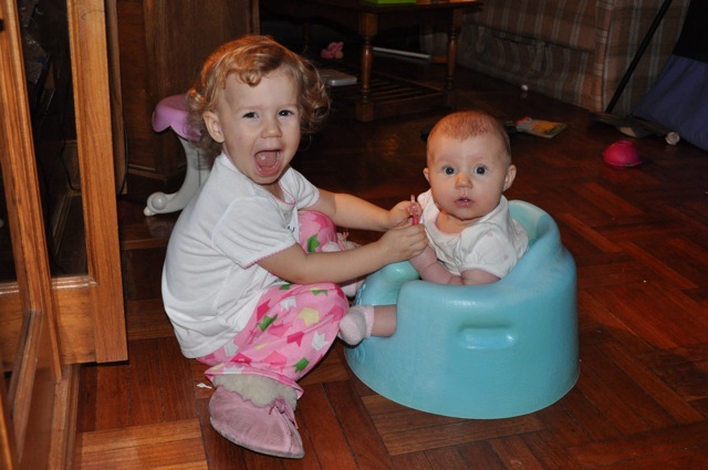 Zoë playing with Kaylee in her Bumbo seat