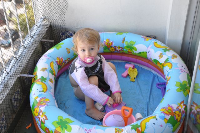 Zoë sitting in empty pool