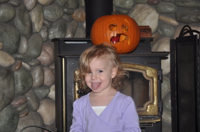 Zoë Showing Off the Pumpkin She Helped Daddy Carve