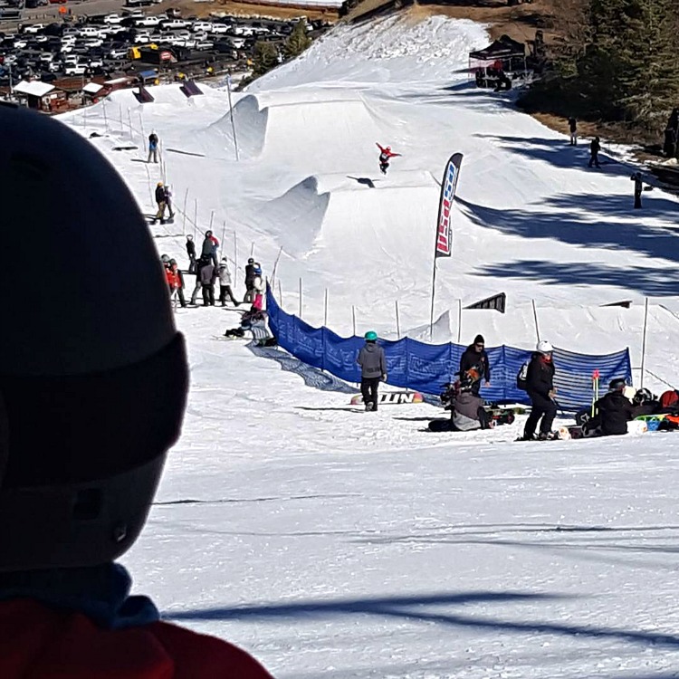 Kaylee watching Zoe on the slopestyle course