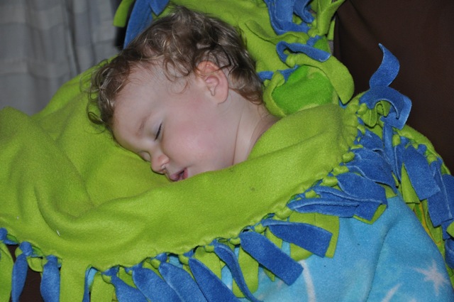 Zoë sleeping wrapped up in her Tinkerbell blanket