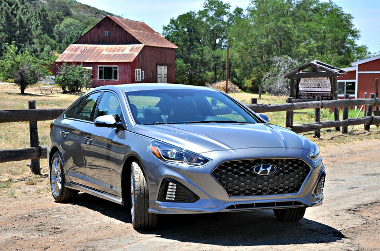 Hyundai Sonata parked in Julian by an old red barn