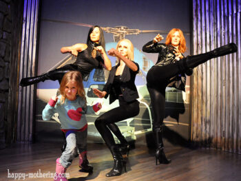 Zoë posing with Charlie's Angels at the Hollywood Wax Museum