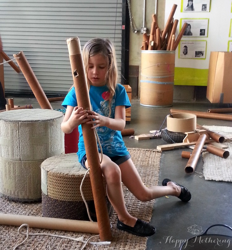 Zoë playing with building tubes at the San Diego Children's Museum