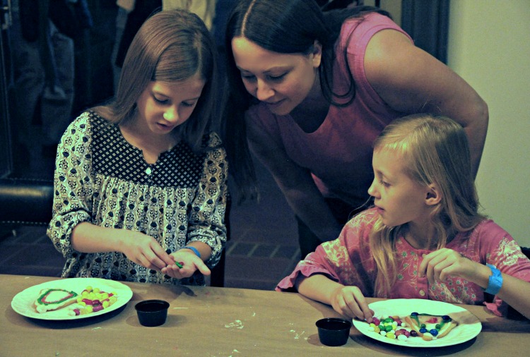 Girls and Chrystal decorating cookies at the Four Seasons Westlake Village Let It Snow Event