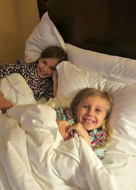 Zoë and Kaylee in their bed at the Four Seasons Westlake Village