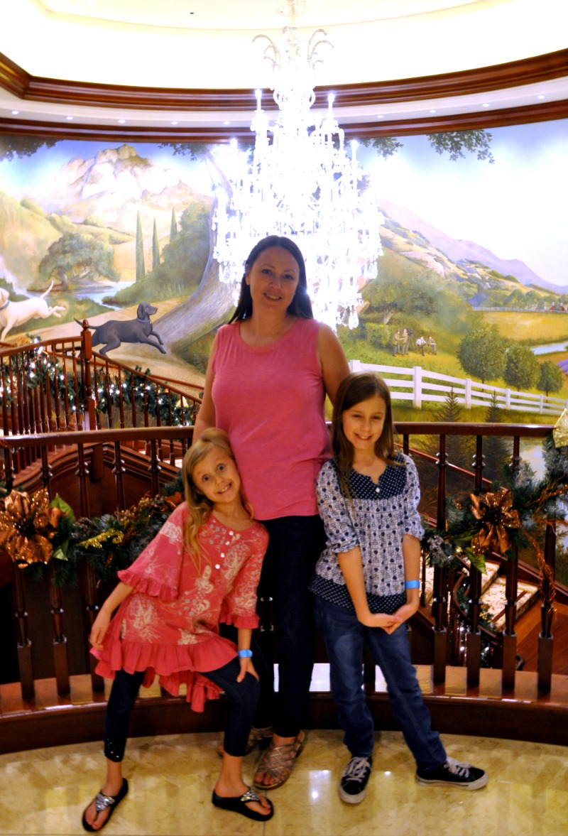 Chrystal, Zoë and Kaylee in front of a chandelier at the Four Seasons Westlake Village