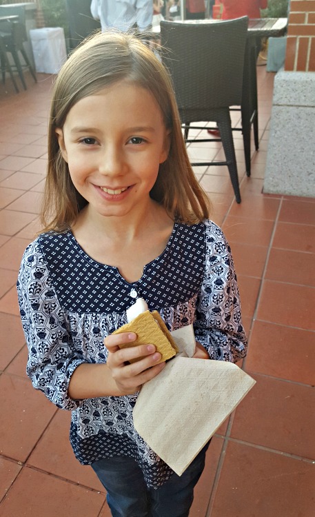 Zoë eating a S'more at the Four Seasons Westlake Village Let It Snow Event