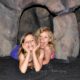 Zoë and Kaylee in a cave at the San Diego Natural History Museum