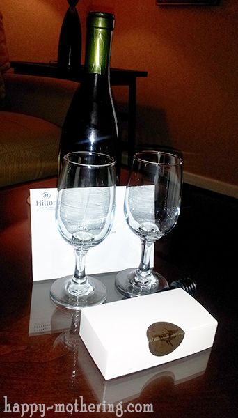 Wine bottle and glasses in Hilton New Orleans room