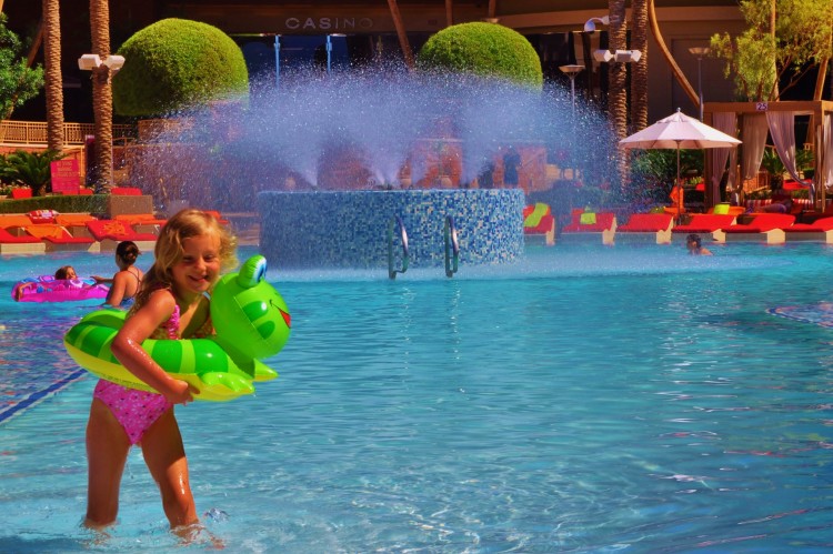 Kaylee wearing a frog floatie at the Red Rock pool