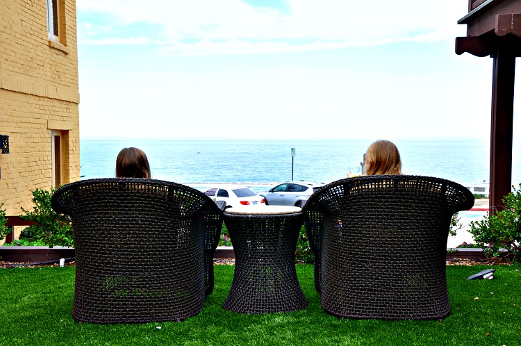 Zoë and Kaylee enjoying the ocean view from the Pantai Inn Courtyard