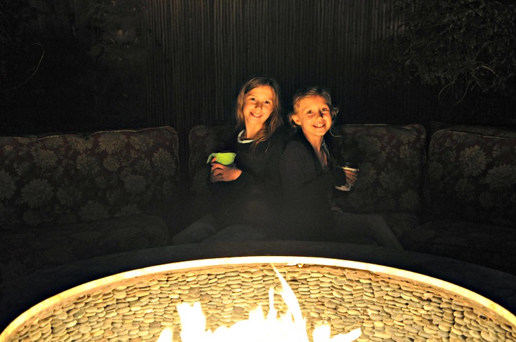 Zoë and Kaylee enjoying hot chocolate by the fire pit at Pantai Inn in La Jolla, CA