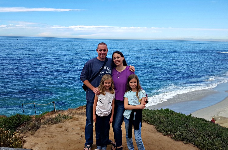 Family photo in front of the ocean in La Jolla, CA