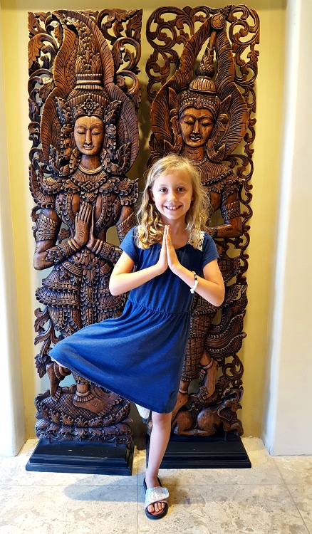 Kaylee practicing tree pose at the Pantai Inn in La Jolla, CA