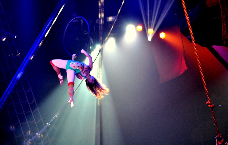 Female acrobat using a ring in the air at the Pirate's Dinner Adventure show