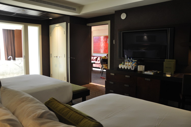 Side angle view of beds, tv and bathroom in our suite at Red Rock Casino Resort