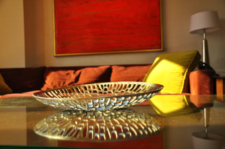 Light reflecting off metal bowl in Red Rock Hotel living room in Las Vegas, NV