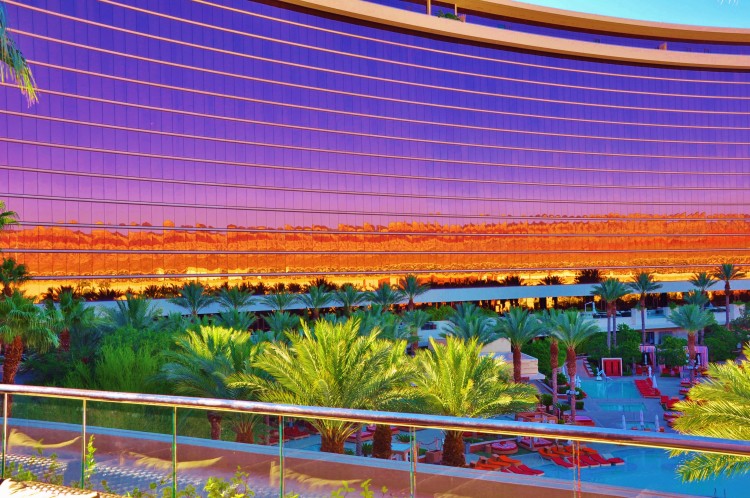 Colorful reflection on Red Rock hotel from pool in the morning