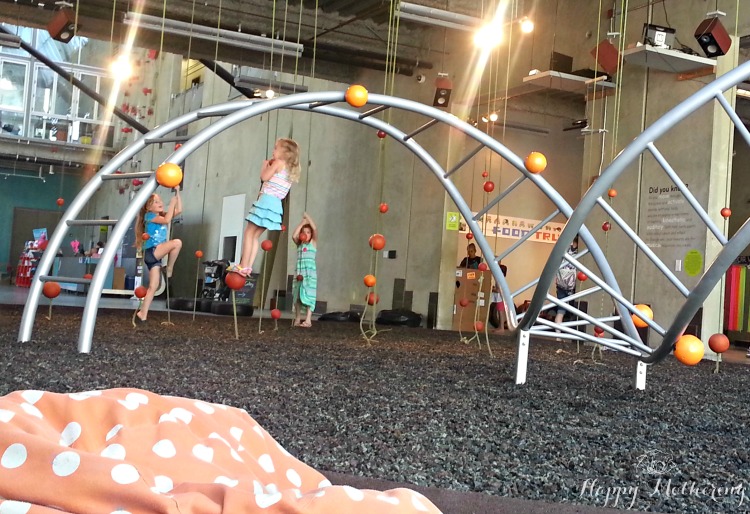 Zoë and Kaylee playing on a feature at the San Diego Children's Museum