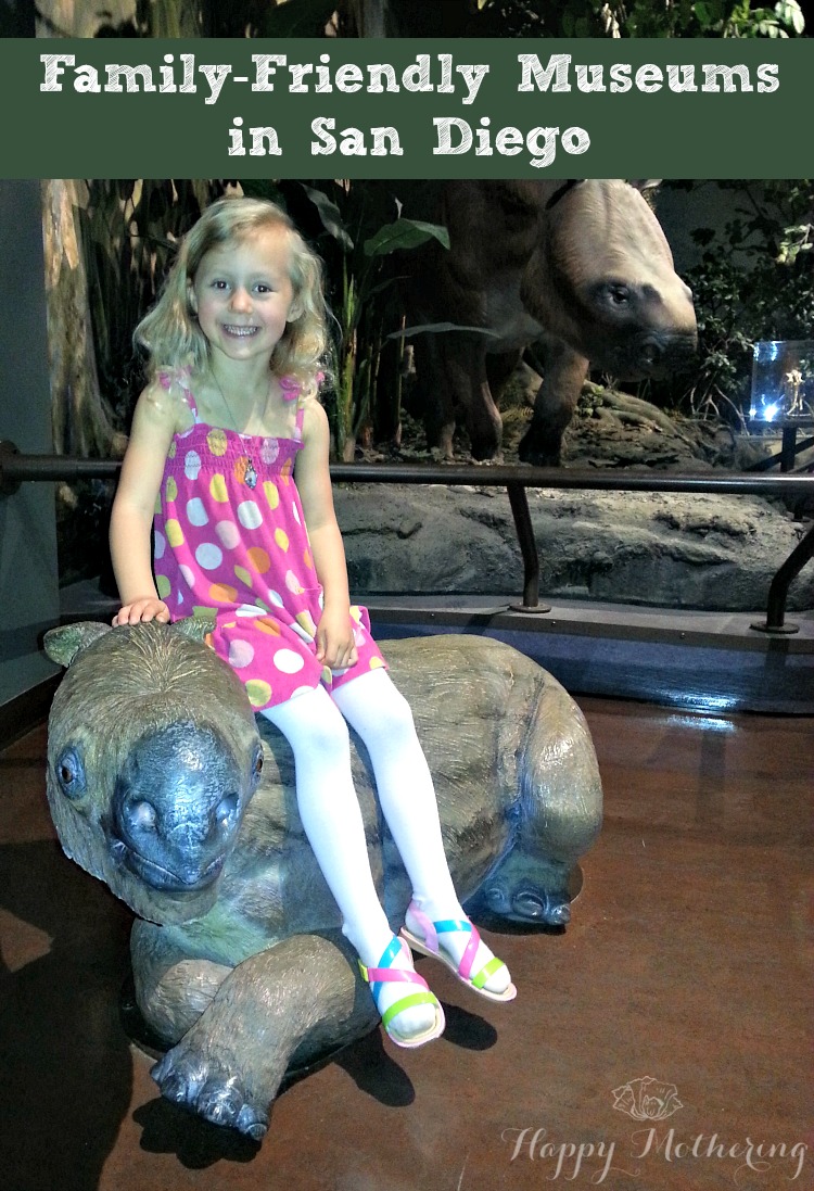 Kalee sitting on a statue at the San Diego Natural History Museum in San Diego, CA