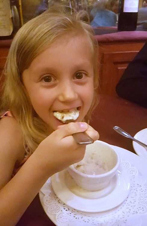 Kaylee eating dessert at The Whaling Station in Monterey, CA