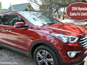 Red Hyundai Santa Fe in a rocky driveway
