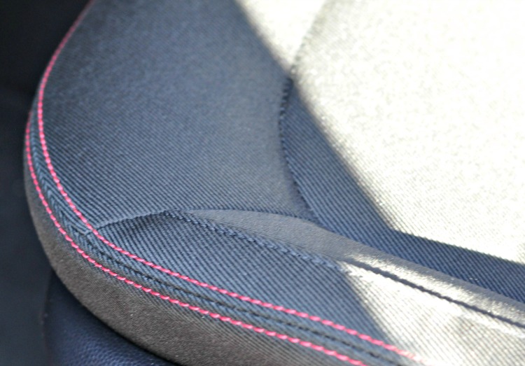 Red stitching on gray cloth seats in Kia Soul