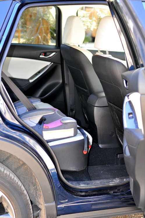 Mazda CX-5 back seat with booster seat in it