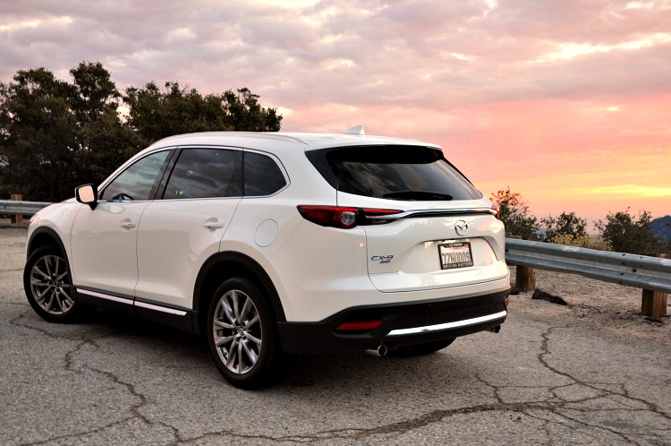 Back angle of Mazda CX-9 with pink clouds in the background