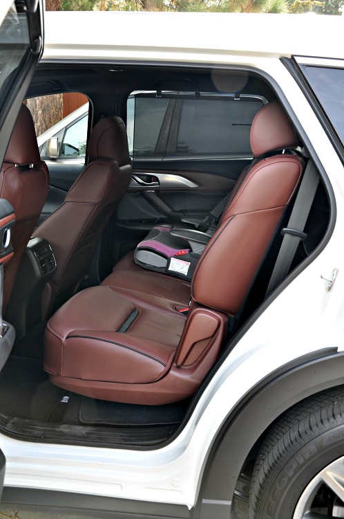 Mazda CX-9 backseat with booster seat in it