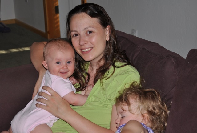 Chrystal, Zoë and Kaylee on the couch with Zoë sleeping